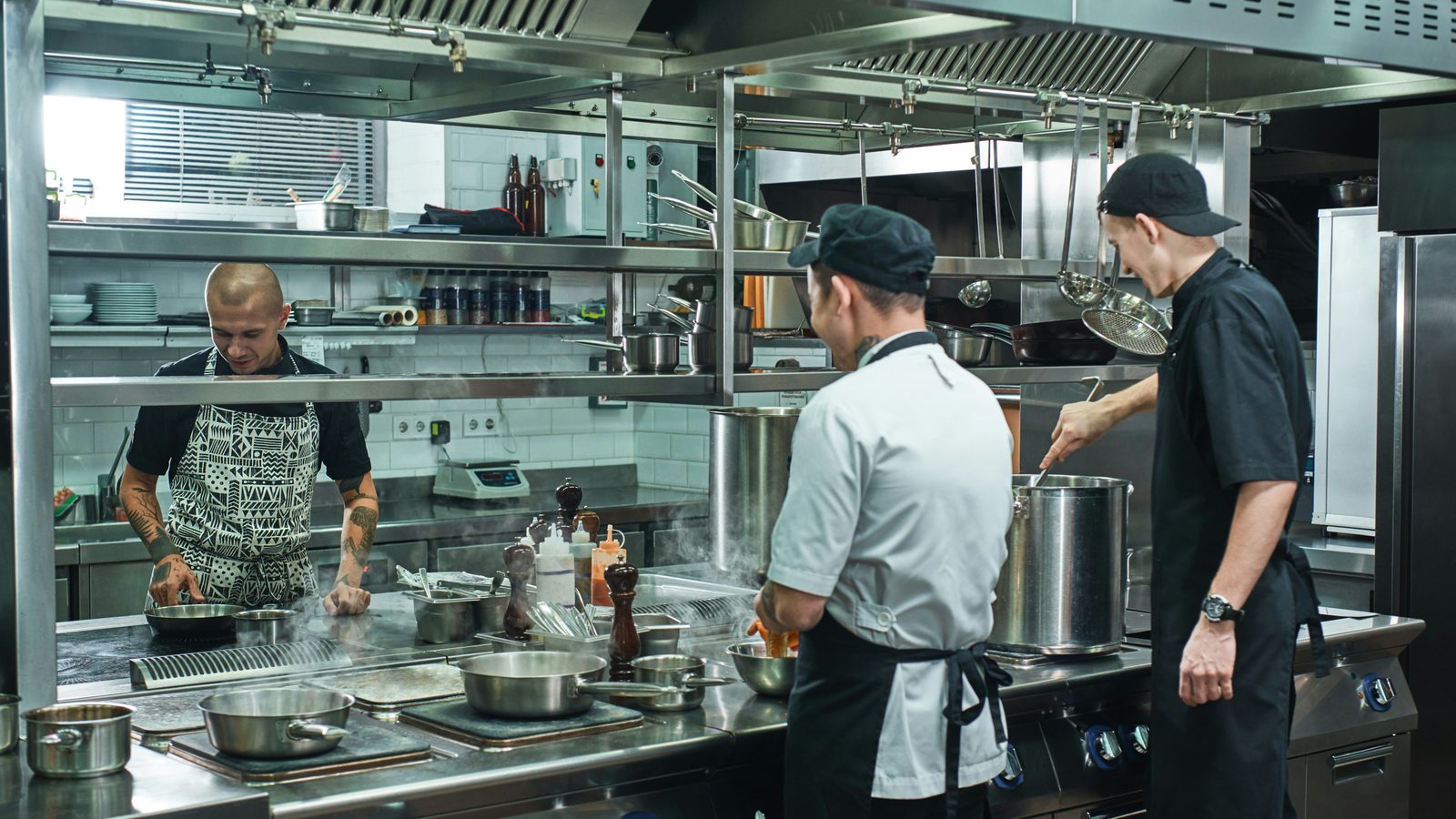 Chefs working in a busy commercial kitchen