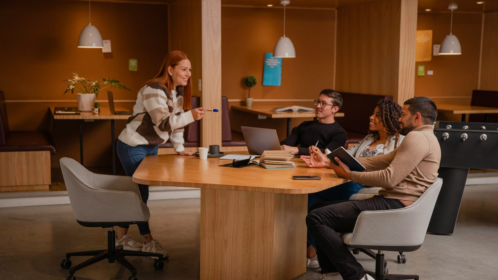 A team gathered around a table for a workshop