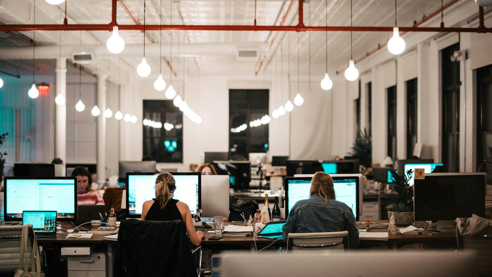 A dim open-plan office at night